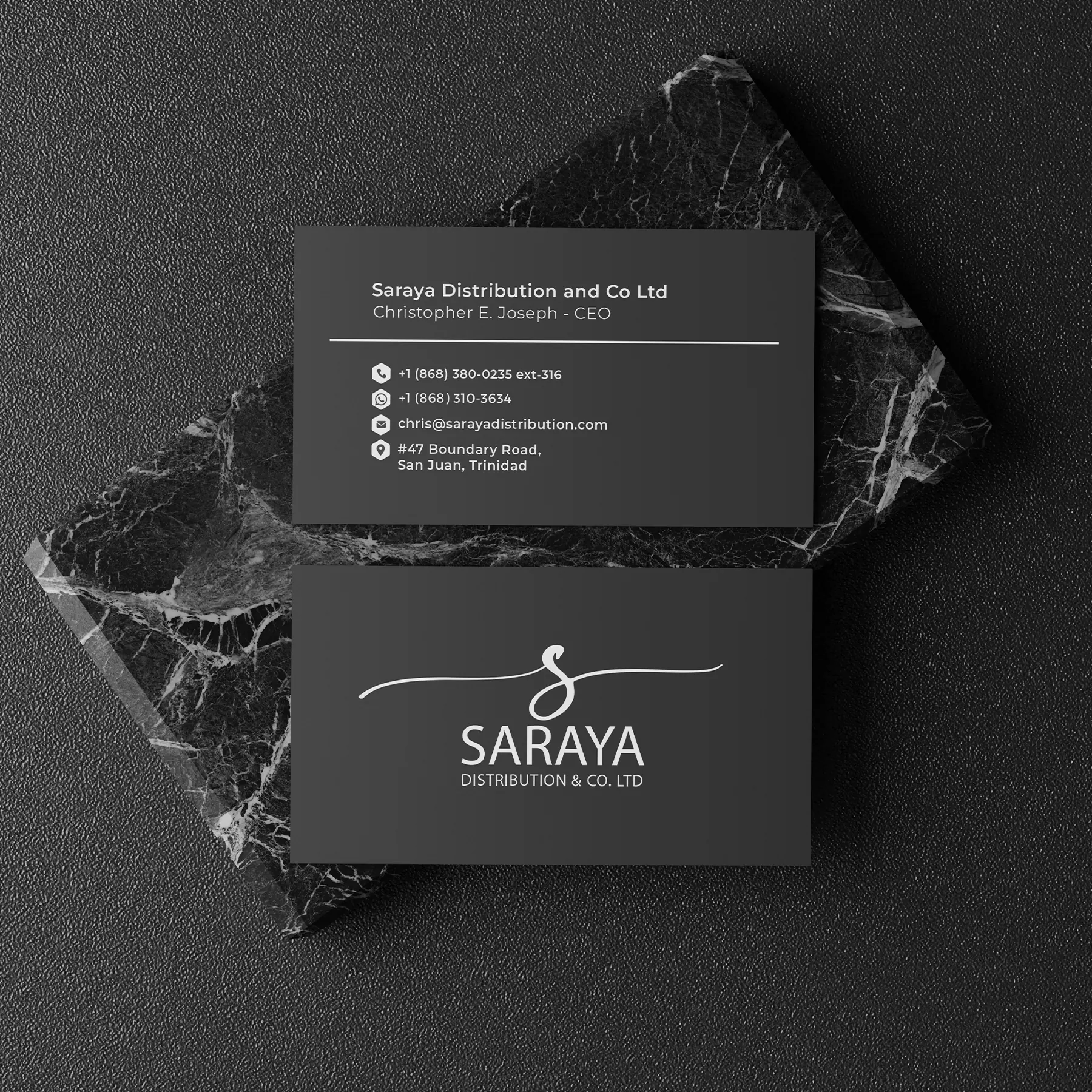 Saraya Distribution business cards on black marble